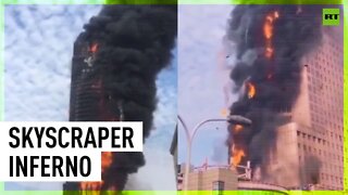 Huge fire engulfs office tower in China