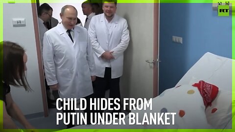Child hides from Putin under blanket