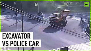 Excavator drives into police car flipping it over
