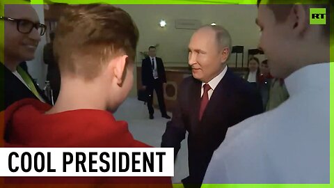 Putin greets children with presidential high five