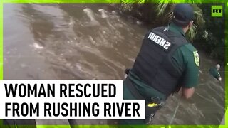 Florida deputies rescue woman whose car was swept away by rushing river