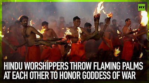 Hindu worshippers throw flaming palms at each other to honor goddess of war
