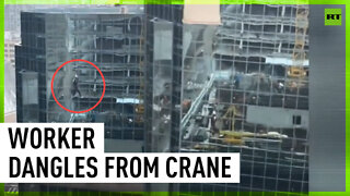 ‘How the f*** this happened?’ Construction worker left dangling from high-rise crane