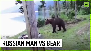Russian man shoos bear away from house in Siberian reserve