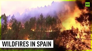 Firefighters battle flames in western Spain