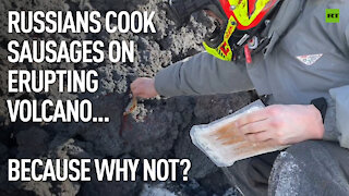 Why not? | Fearless Russian hikers cook sausages on cooling lava of erupting volcano