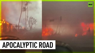 Car drives through Hawaiian inferno