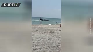 WWII plane crash-lands in the ocean near Florida beach