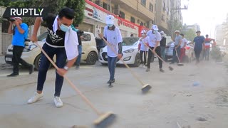 Airstrike Aftermath | Volunteers clean up Gaza streets following ceasefire