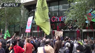 XR protesters throw red paint at London's Guildhall