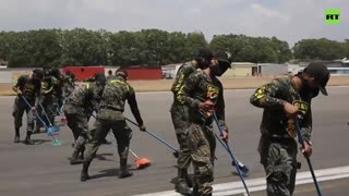 Airport to Ashport | Guatemalan soldiers clean runway following volcano eruption