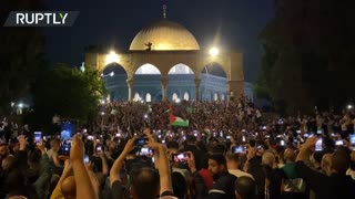 Hundreds celebrate Hamas-Israeli ceasefire at Al-Aqsa mosque in East Jerusalem