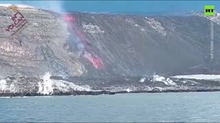 Lava from Cumbre Vieja volcano flows towards beach