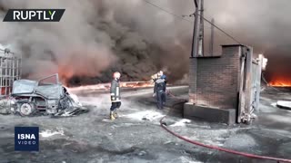 Iranian firefighters battle massive blaze at alcohol factory near Tehran